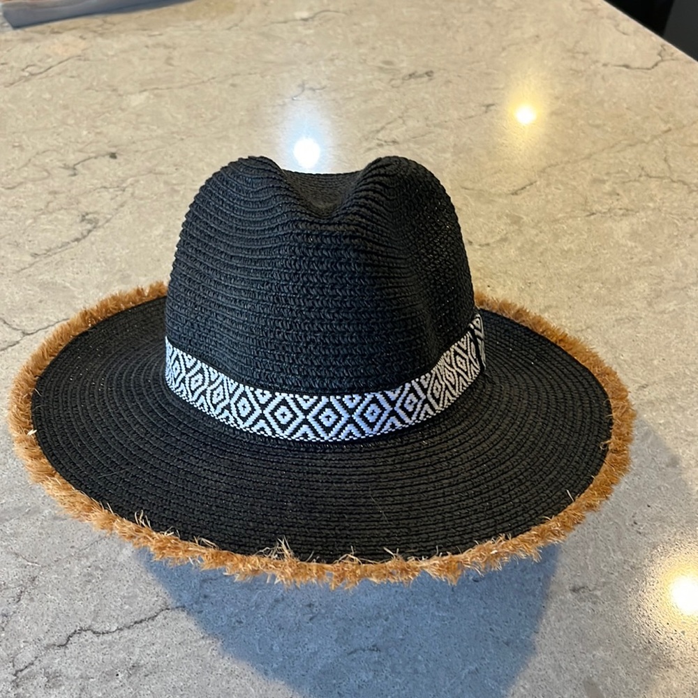 Black hat with white/black/straw trim. NWT.